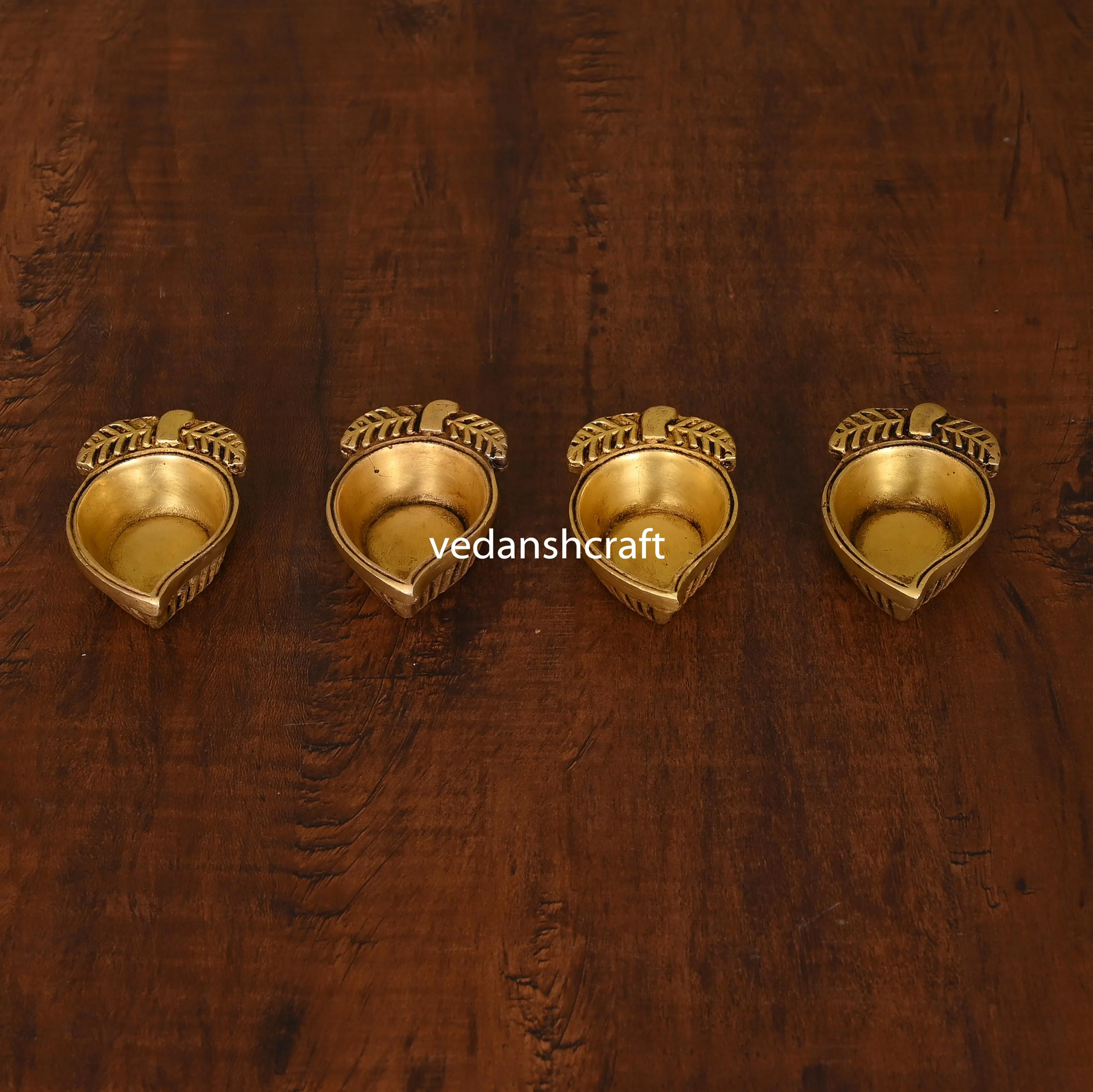 Brass Mango Shape Diya Set Of Four - Image 3